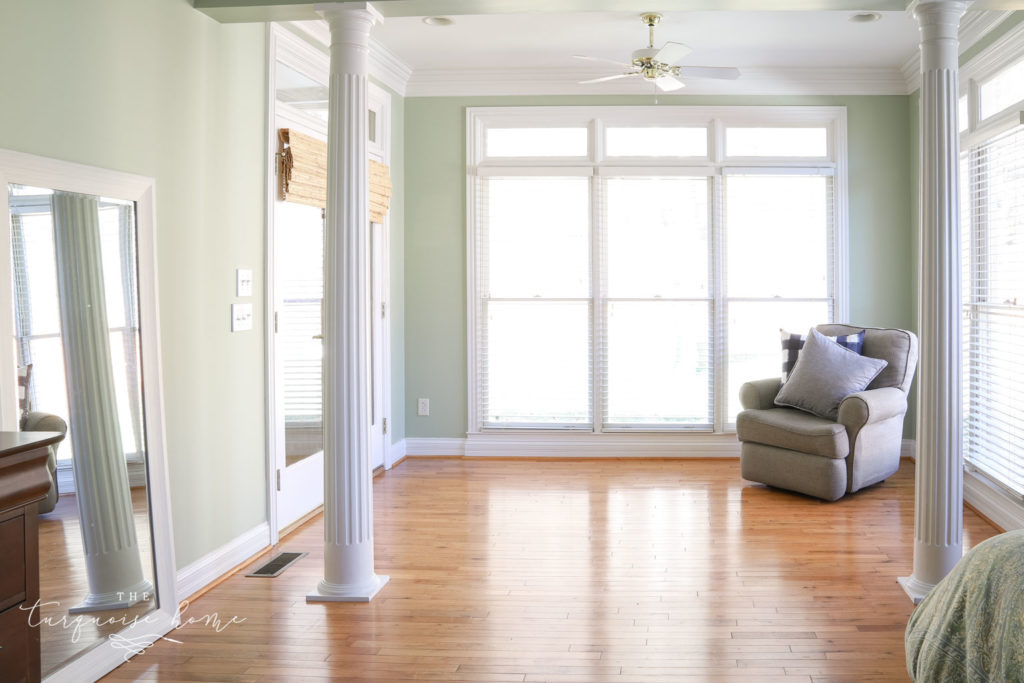 Master bedroom sitting area with columns.