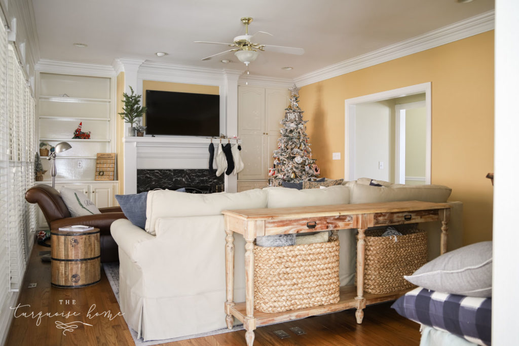 Living room with PB Comfort sectional sofa and gold walls. 