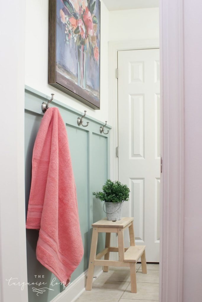 Farmhouse bathroom with hooks for towels