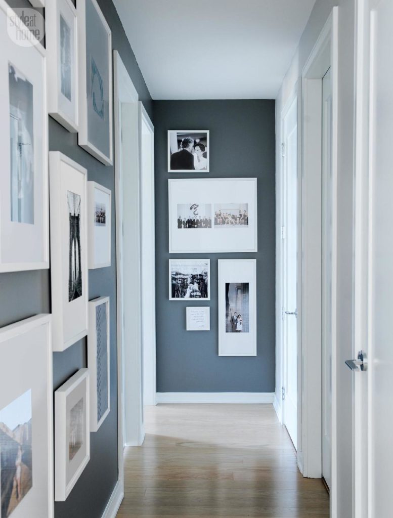 hallway decor ideas include creating a gallery of personal photos like this hallway