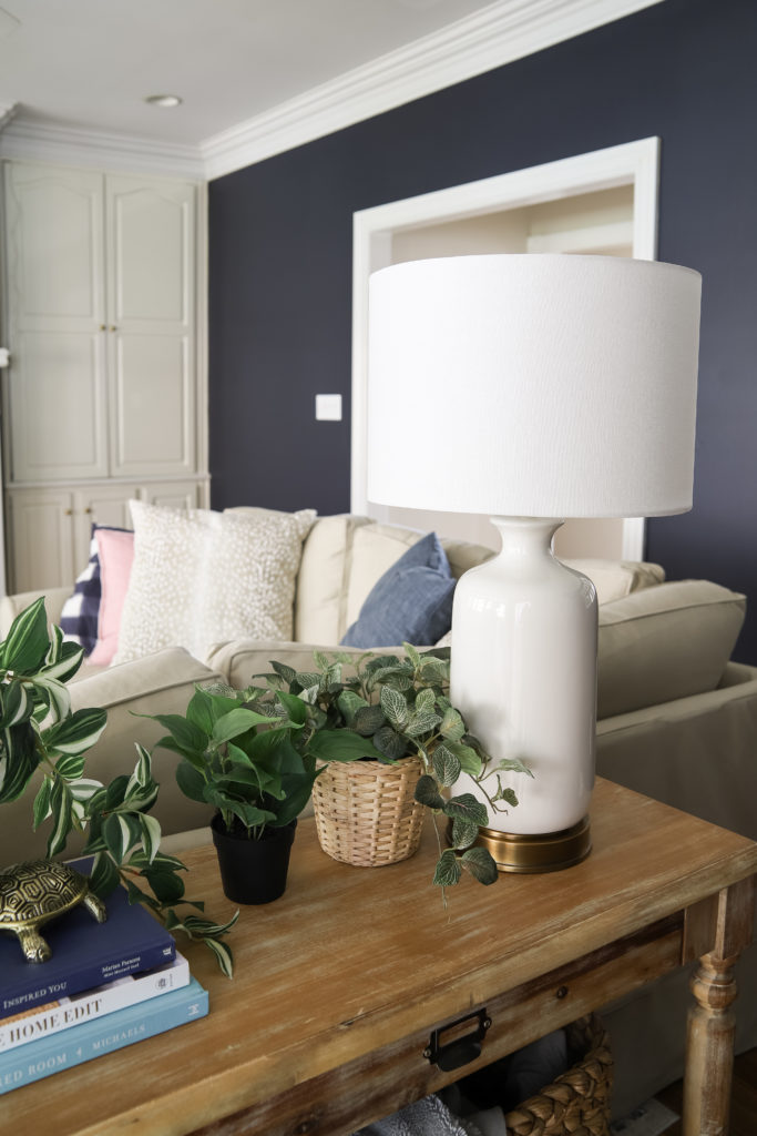 White USB Lamps and Faux Plants and Wooden Console Table