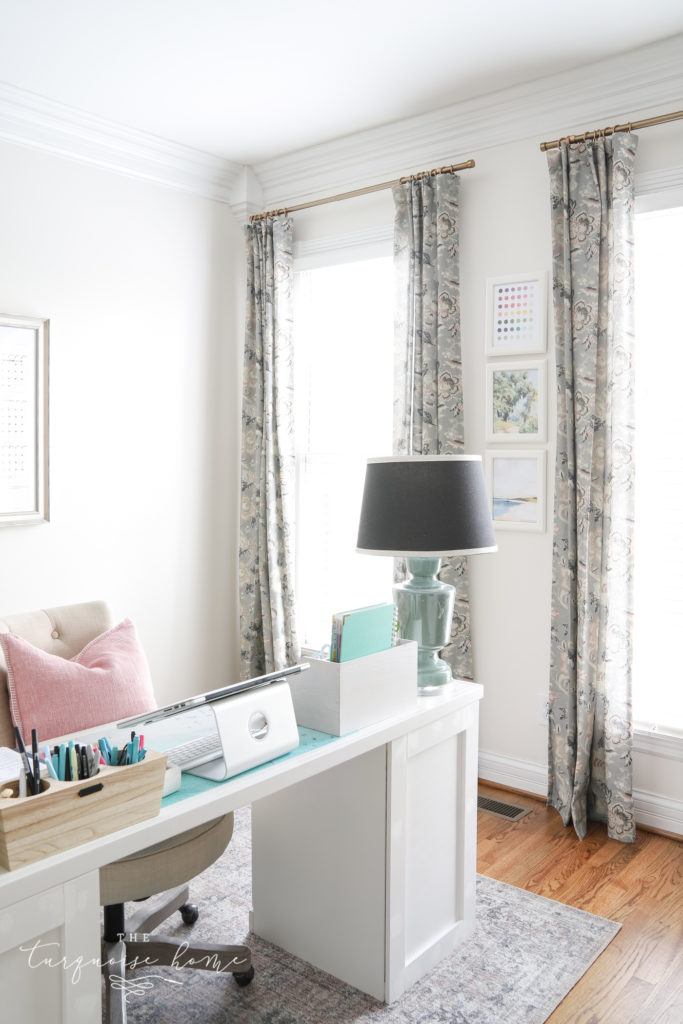 Pretty floral curtains in a feminine office.