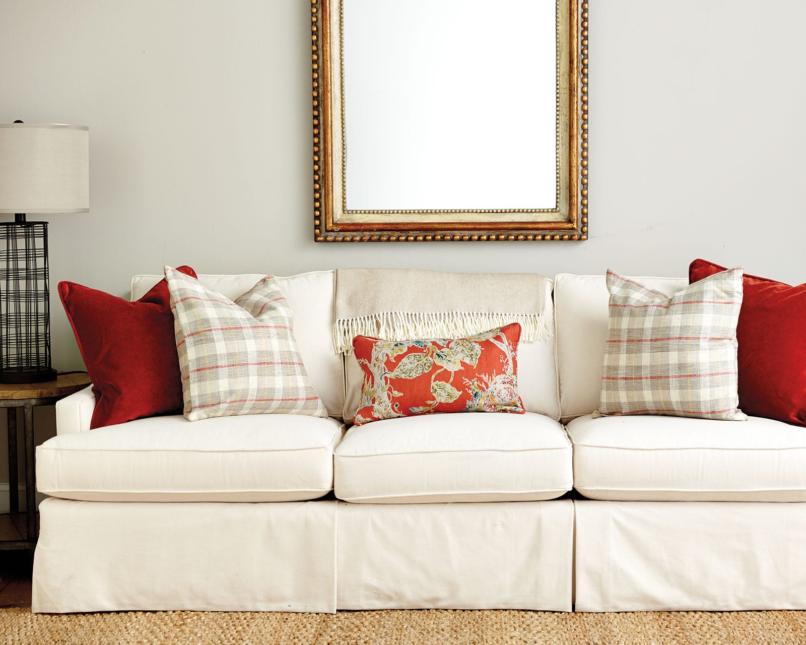 cream colored couch with multiple throw pillow sizes
