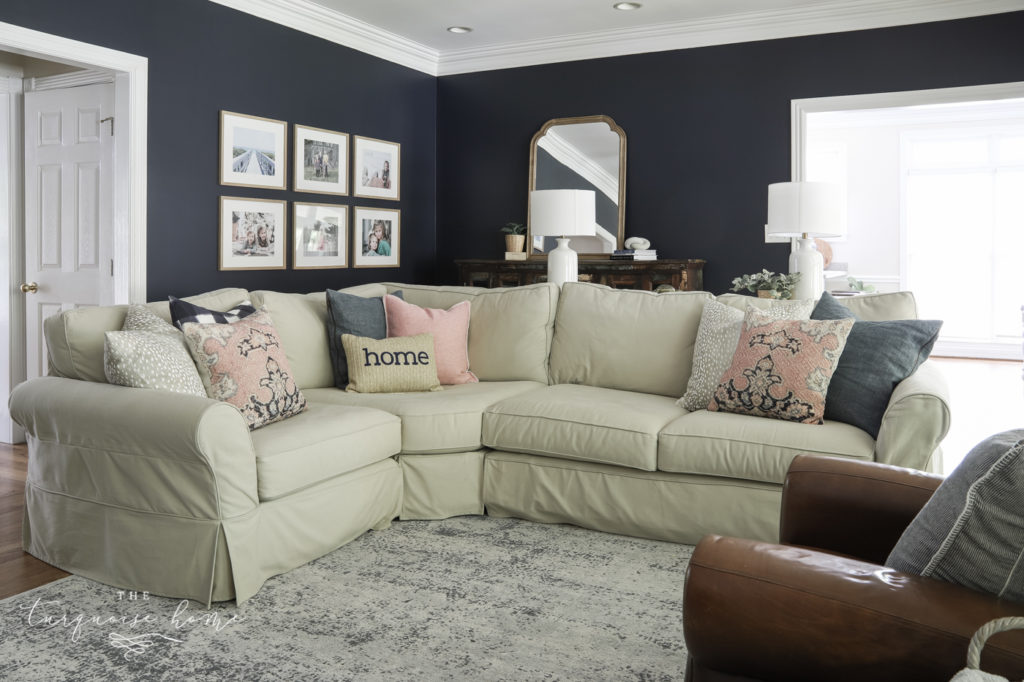 Sectional sofa in living room with throw pillows