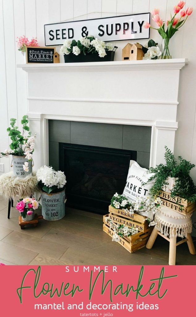 a wide sign and jars of flowers on a fireplace mantel