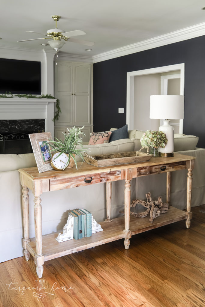 white console table behind couch