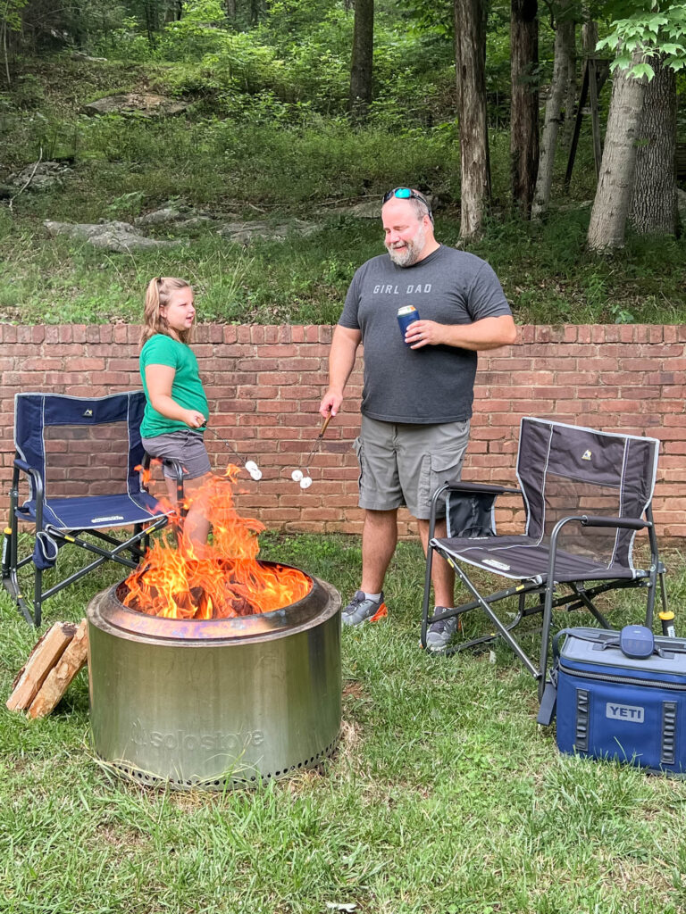 Dad with daughter and bonfire
