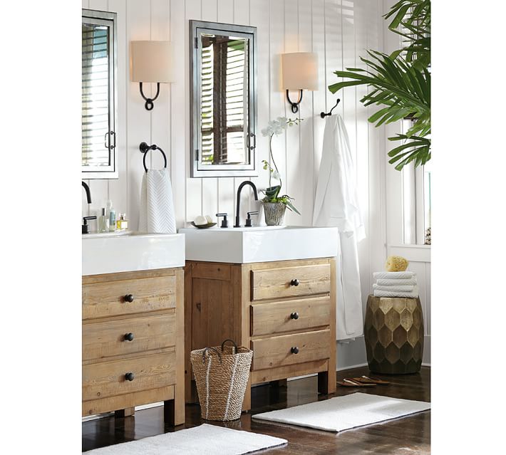 two single wood farmhouse bathroom vanities with white farmhouse sinks in a bathroom