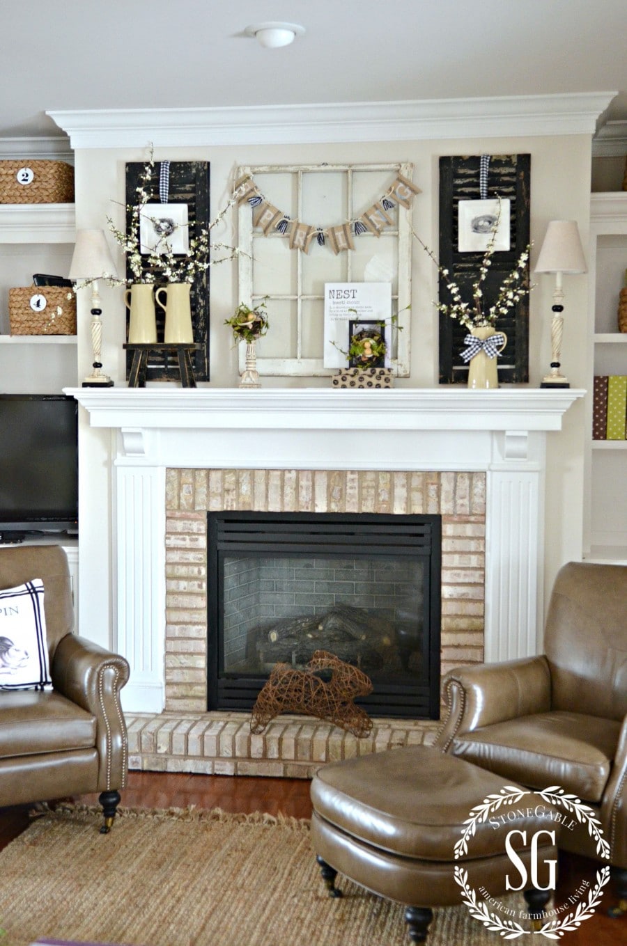 neutral spring mantel decor with candles, pitchers, and florals