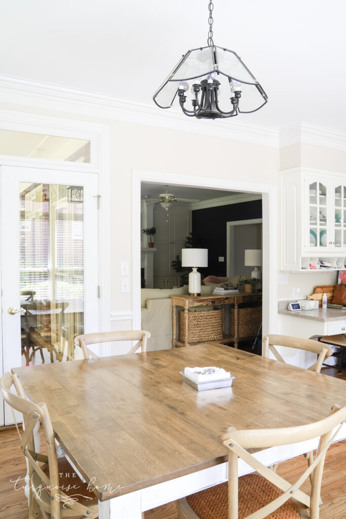 kitchen table with broken chandelier above