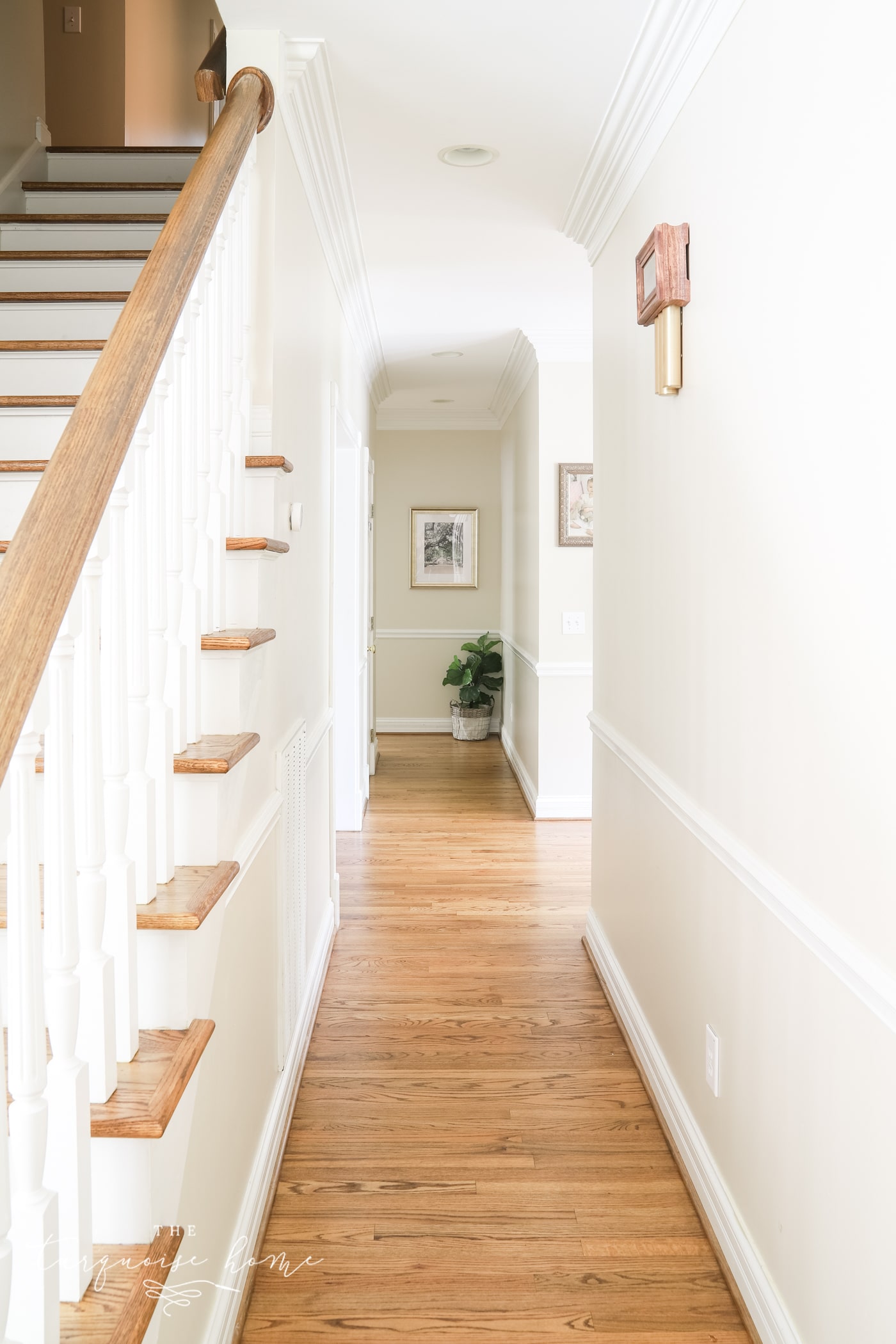 long hallway with medium brown wood floors.