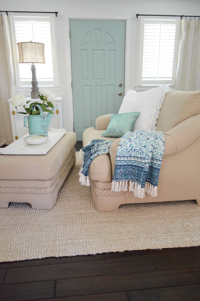 living room with a door painted Wythe Blue.