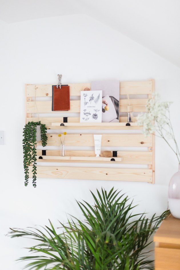 IKEA hack: mount a shelf sideways on a wall for minimalist entryway storage and styling.