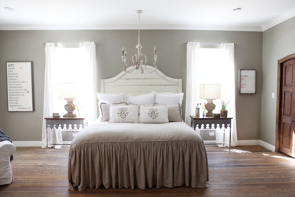 Classic bedroom with an off-white decor palette and Sherwin Williams Mindful Gray wall color.