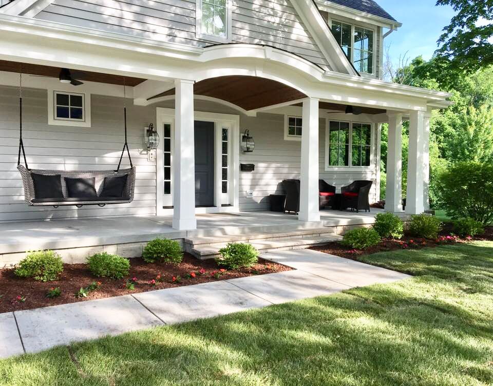 exterior of a craftsman-style home with peppercorn gray door, Sherwin Williams Mindful Gray painted siding and Alabaster for the trim.