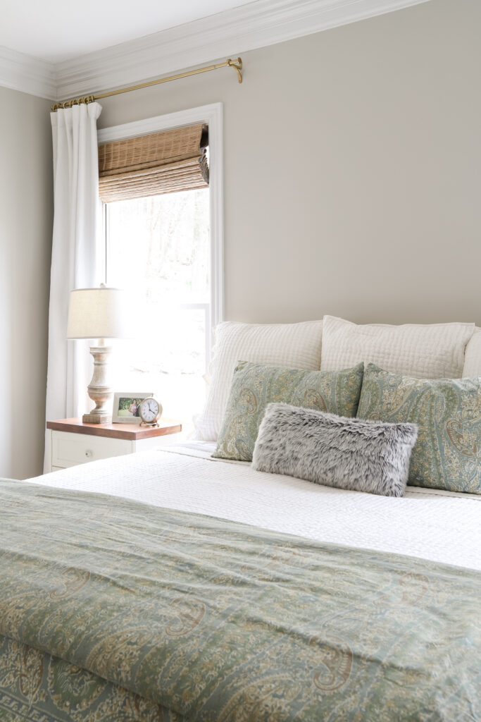 Brass Curtain Rods and Ivory Curtains in the Master Bedroom