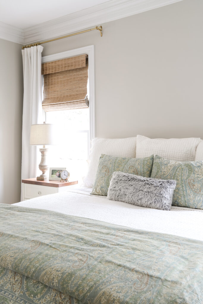 Bamboo Shades and Black Out Curtains as window treatment options in a bedroom