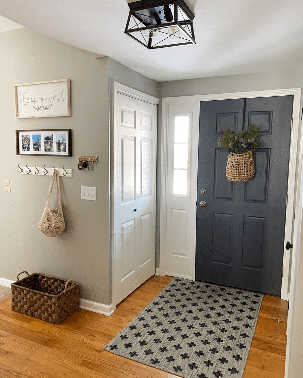 entry way with dark gray door and Mindful Gray painted walls