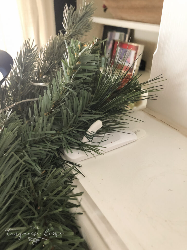 Command hook on the mantel to hold garland