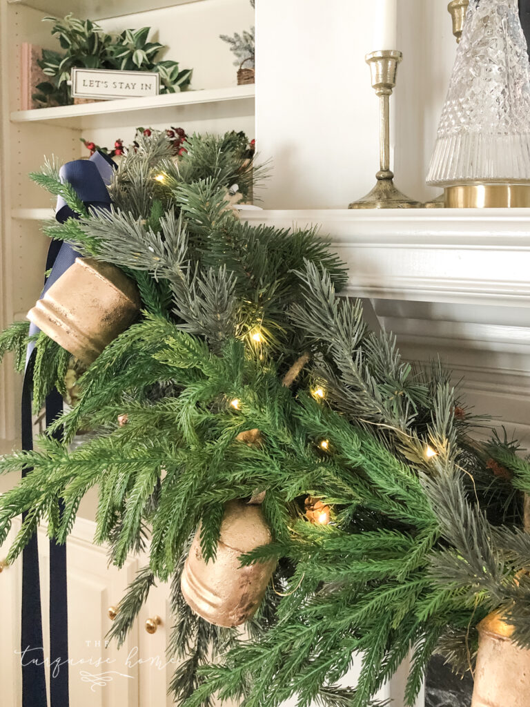 Brass iron bells hanging on a Christmas mantel