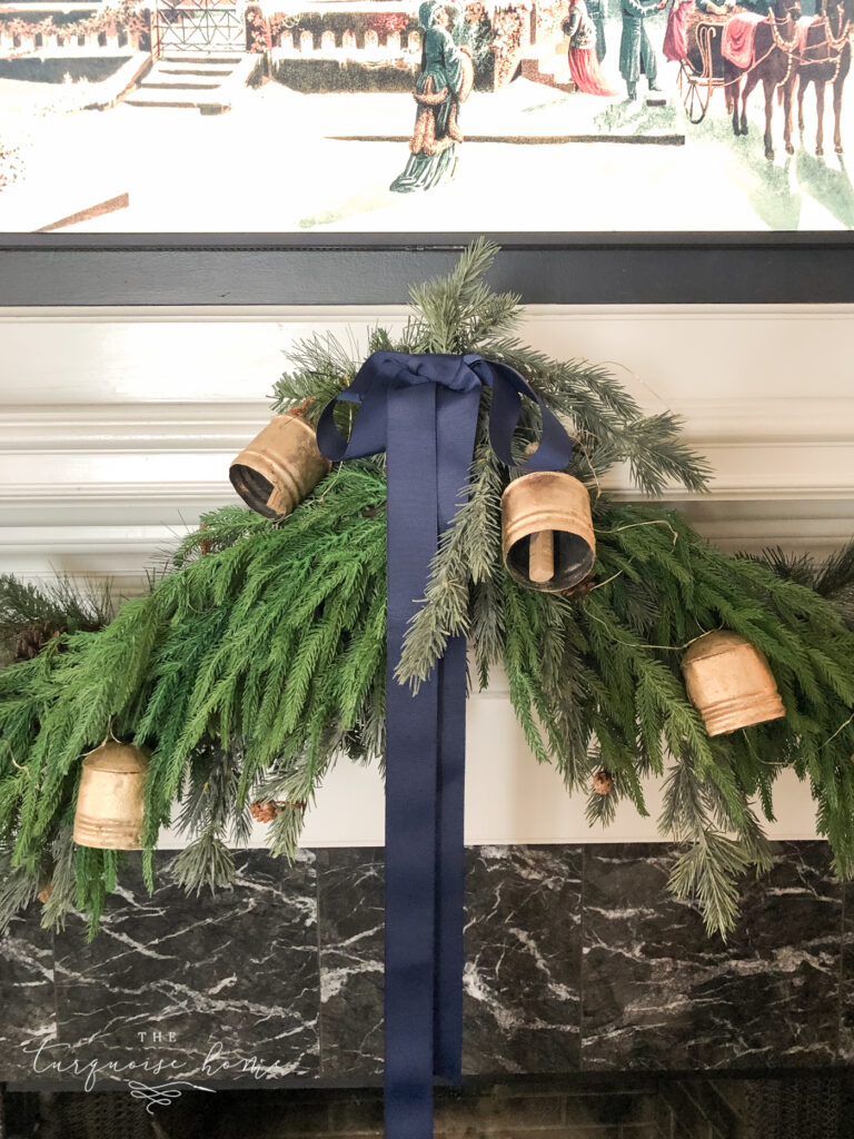 navy bow and brass bells in Christmas garland