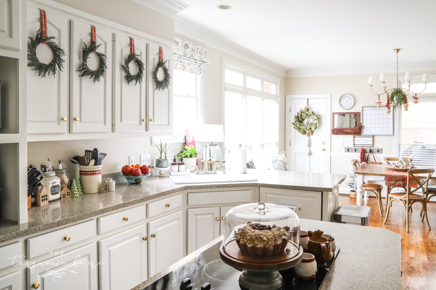 Christmas Wreaths on White Kitchen Cabinets