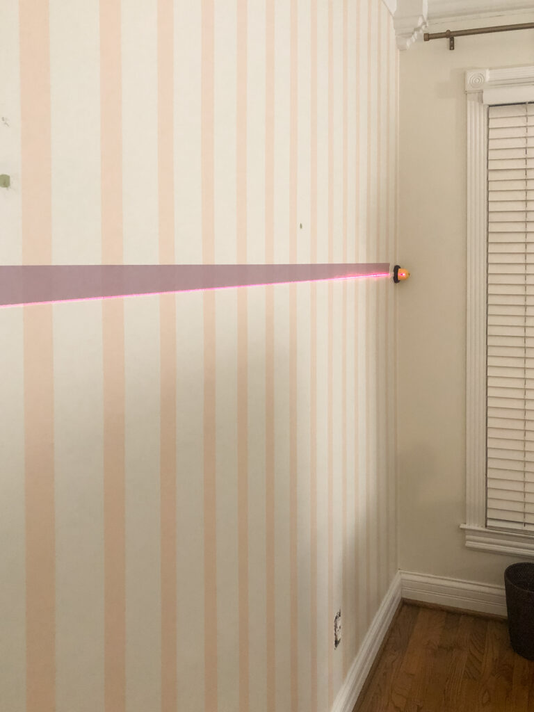 Laser level on striped wall