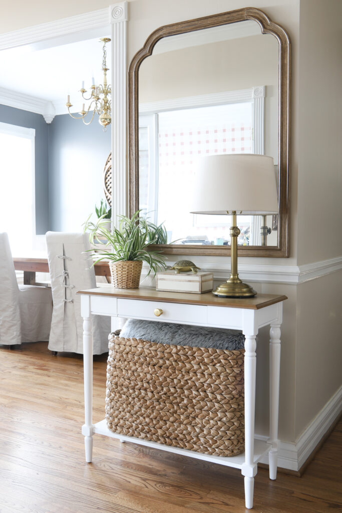 An Organized Foyer with table, lamp and mirror!