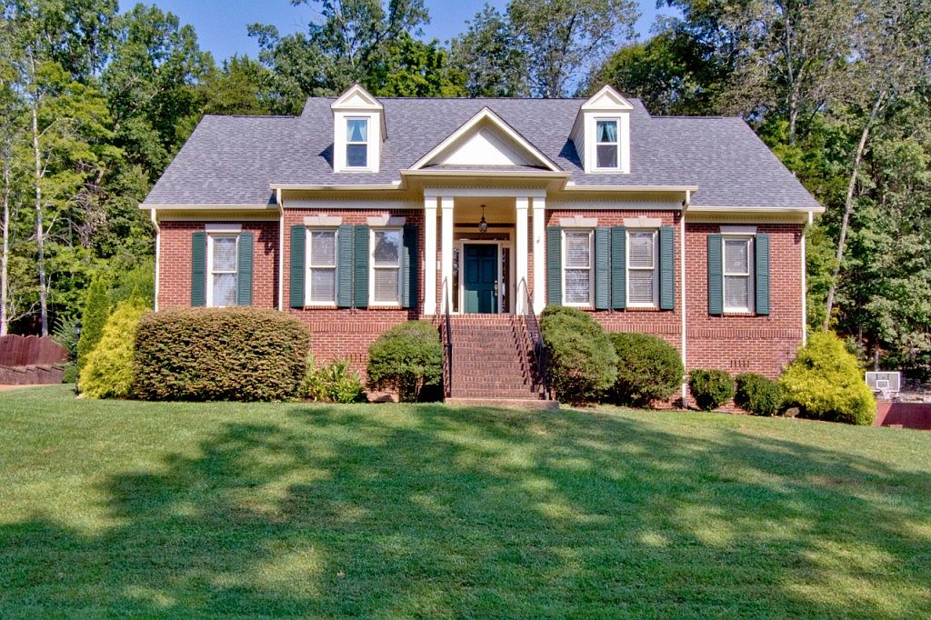 We Painted Our Trim White - white house black shutters