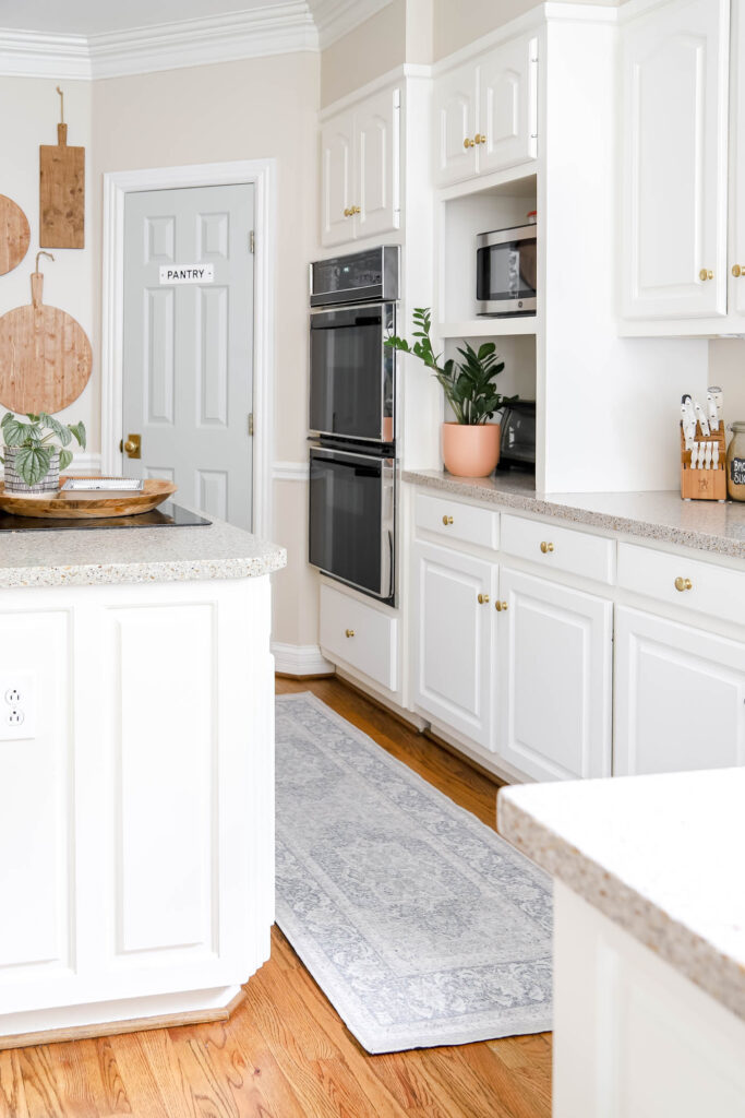 White Kitchen with Blue Rug