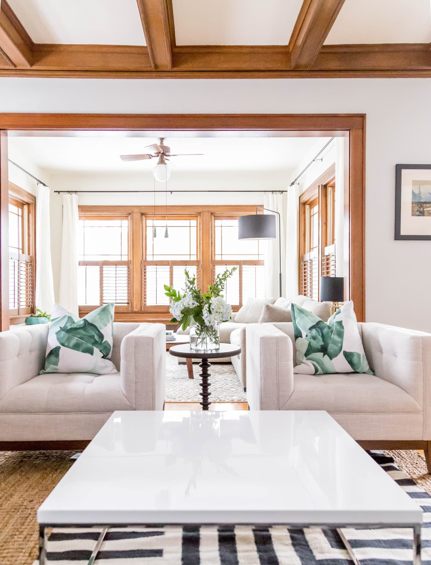 living room with wood trim and neutral white paint