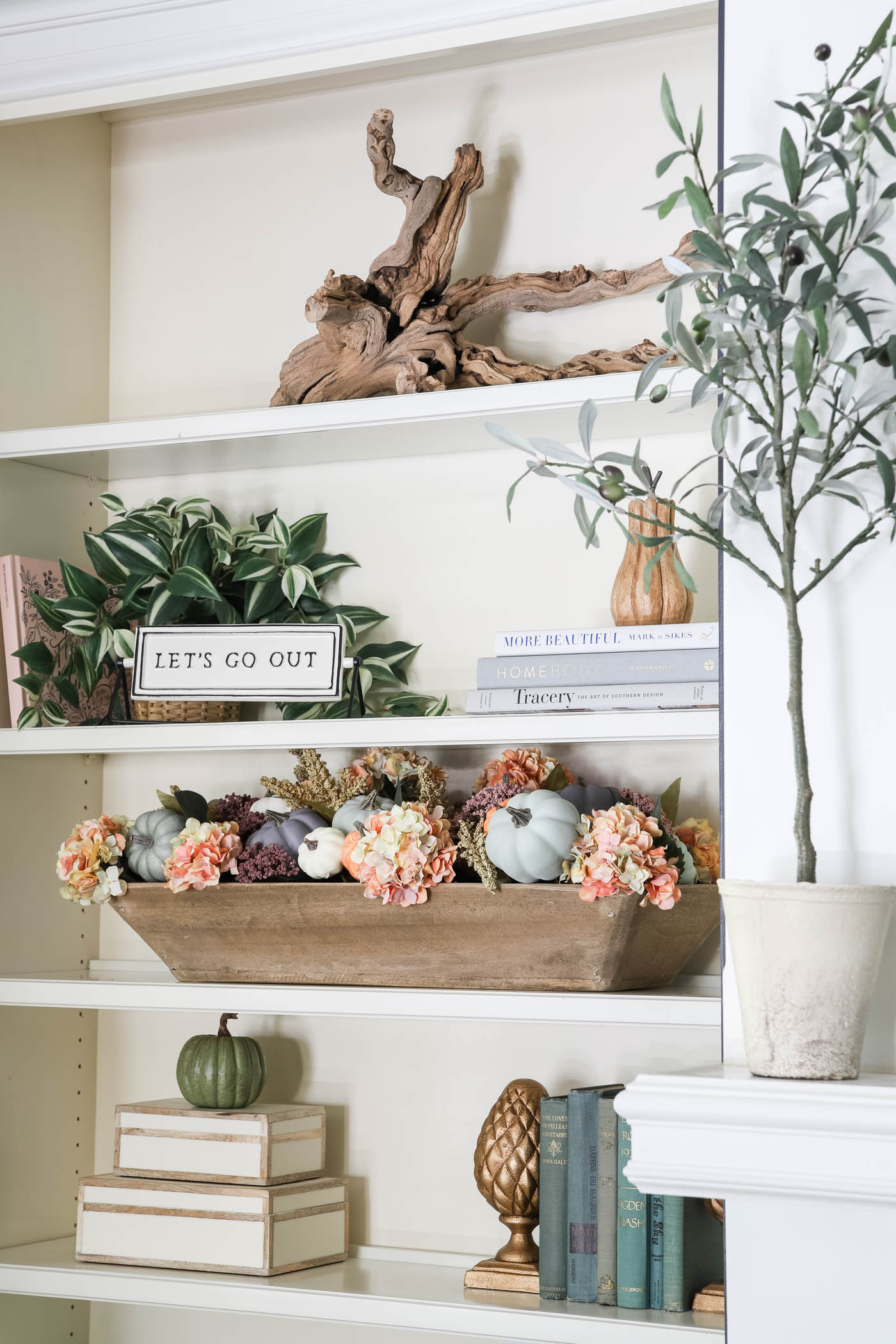 fall bookshelf decor with faux hydrangeas