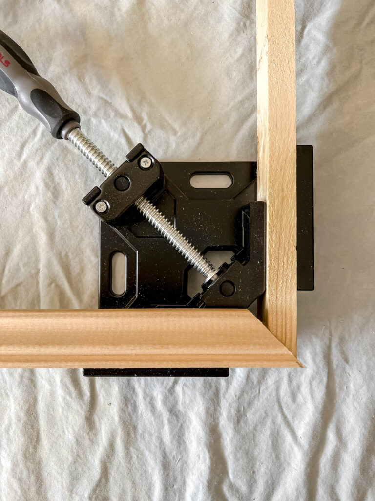 Corner miter clamp with wood trim