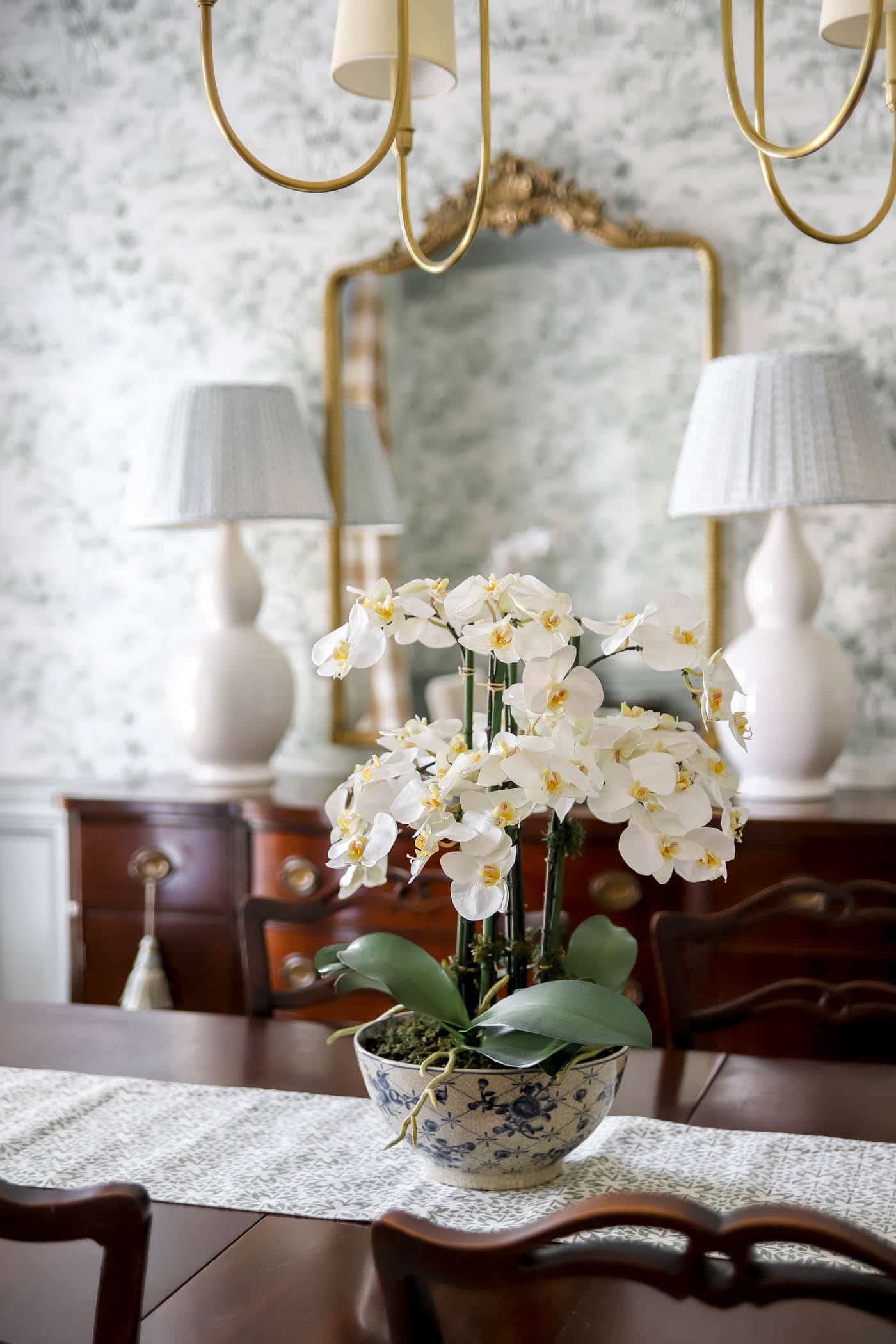 Faux orchid plant in dining room