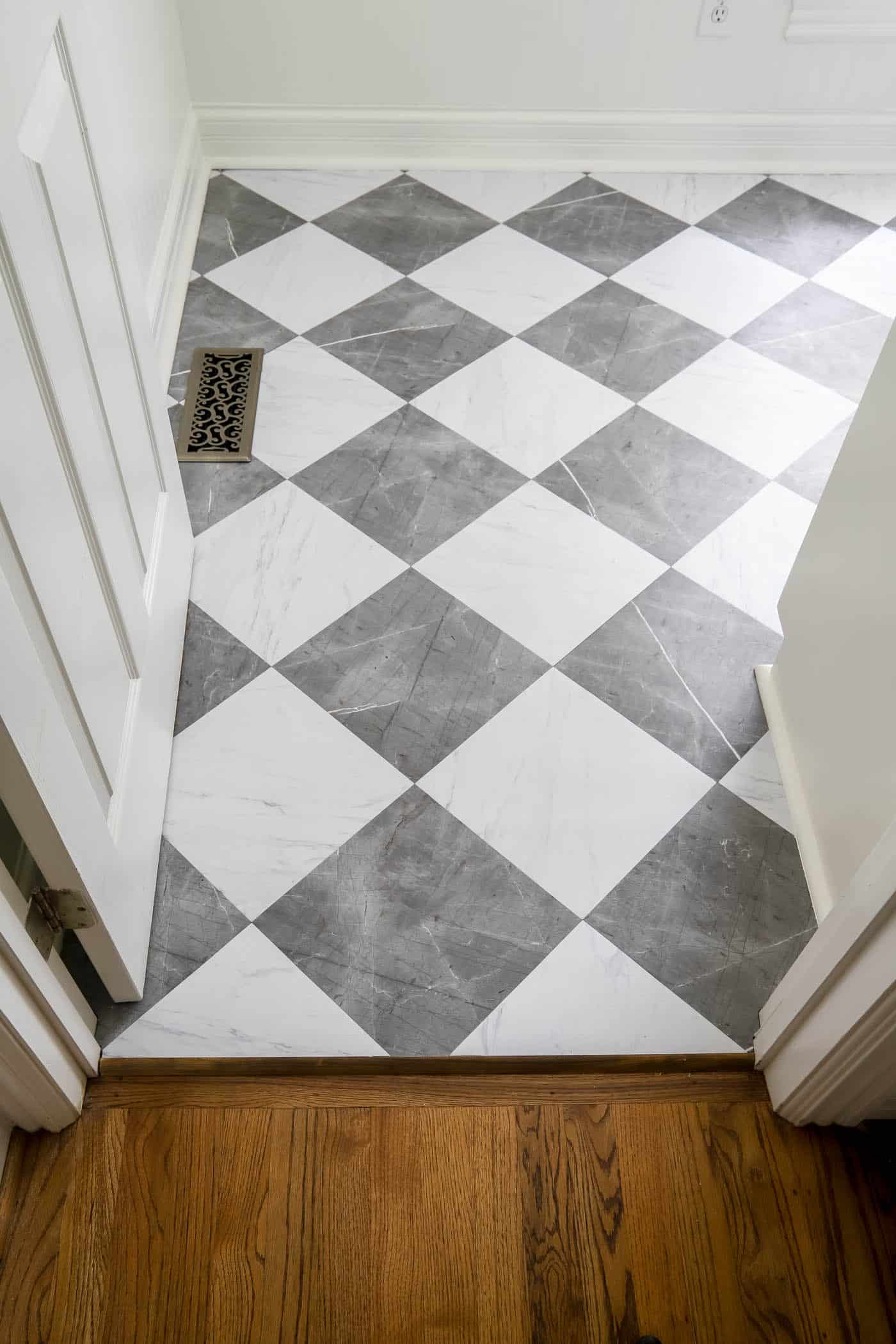 Checkerboard vinyl tiles in laundry room