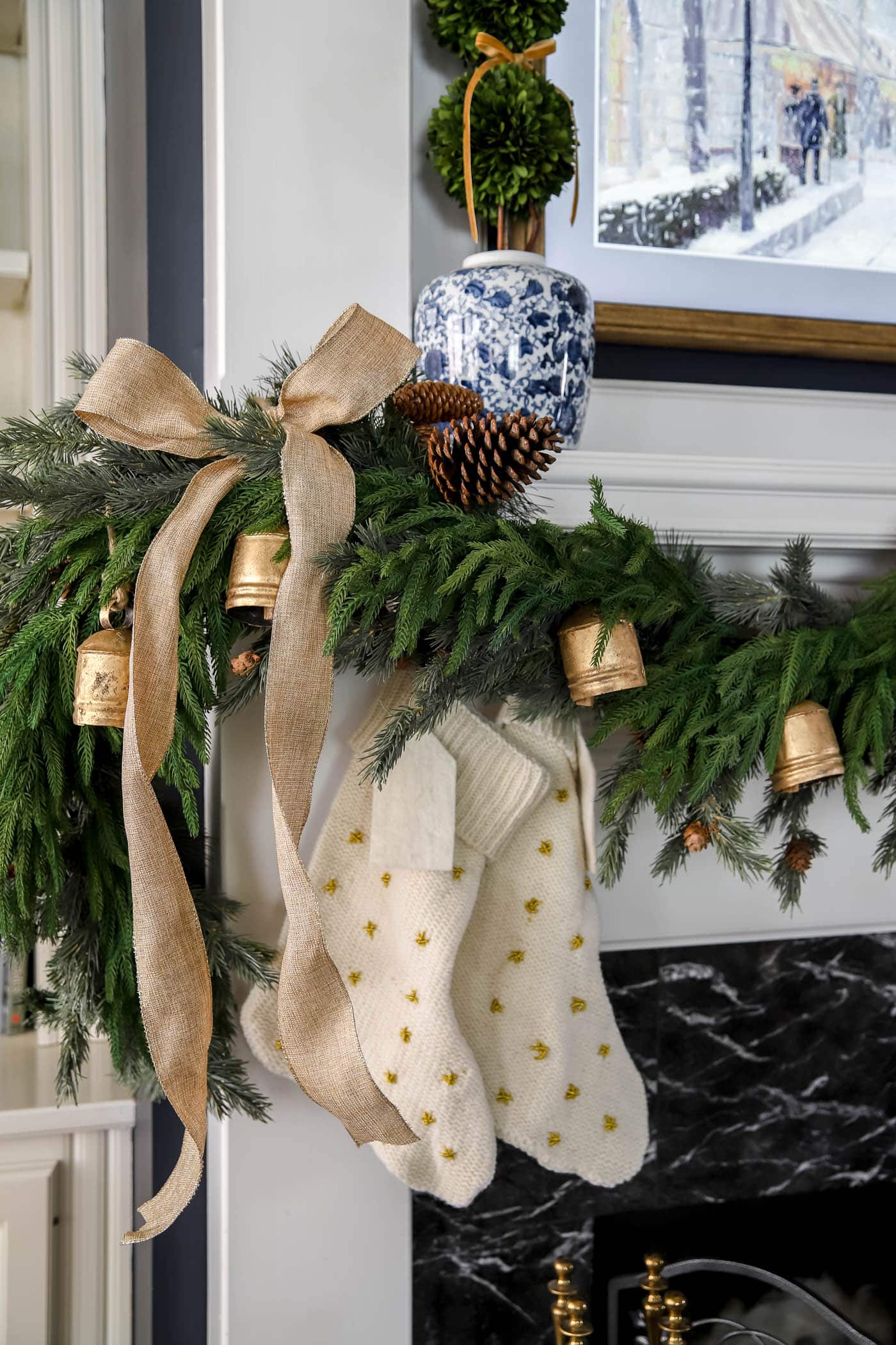 gold, blue and White Christmas decor on the mantel