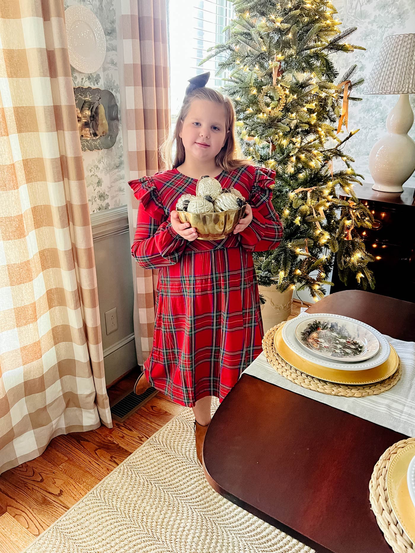 Little girl in plaid Christmas dress