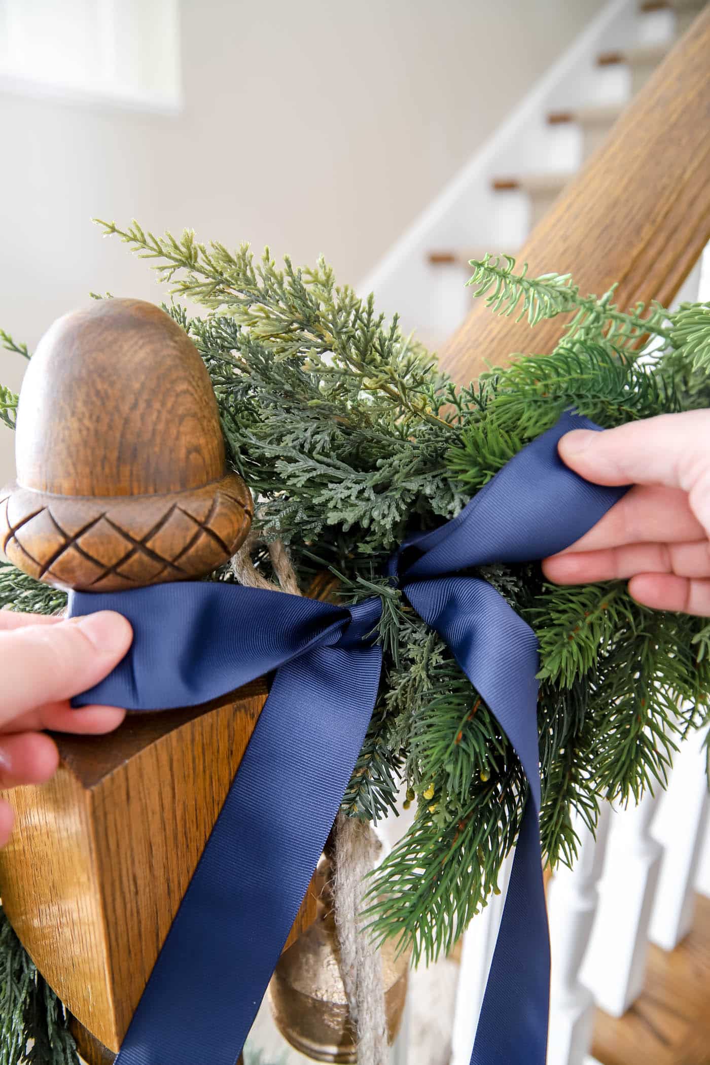 Bow accessories on stairwell garland