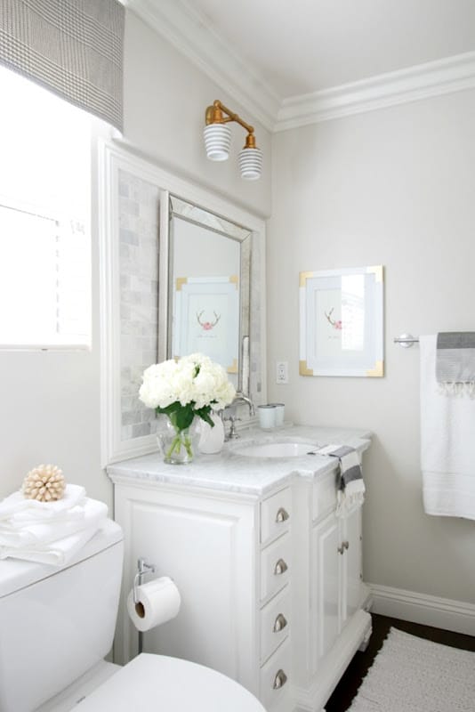crisp white bathroom with pale oak walls