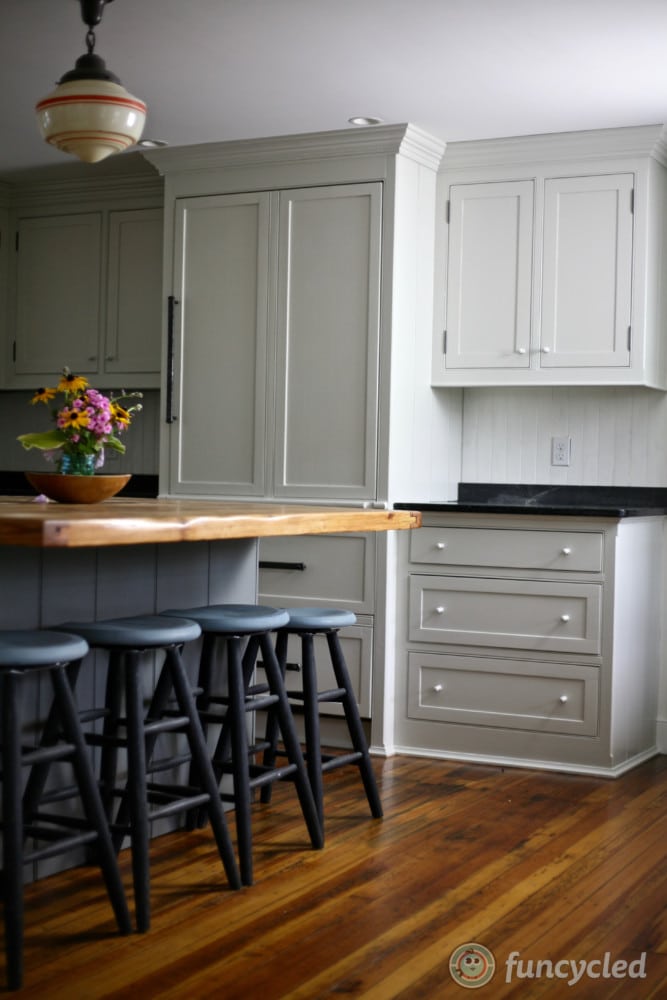 Benjamin Moore Stonington Gray kitchen cabinets paired with a darker gray island
