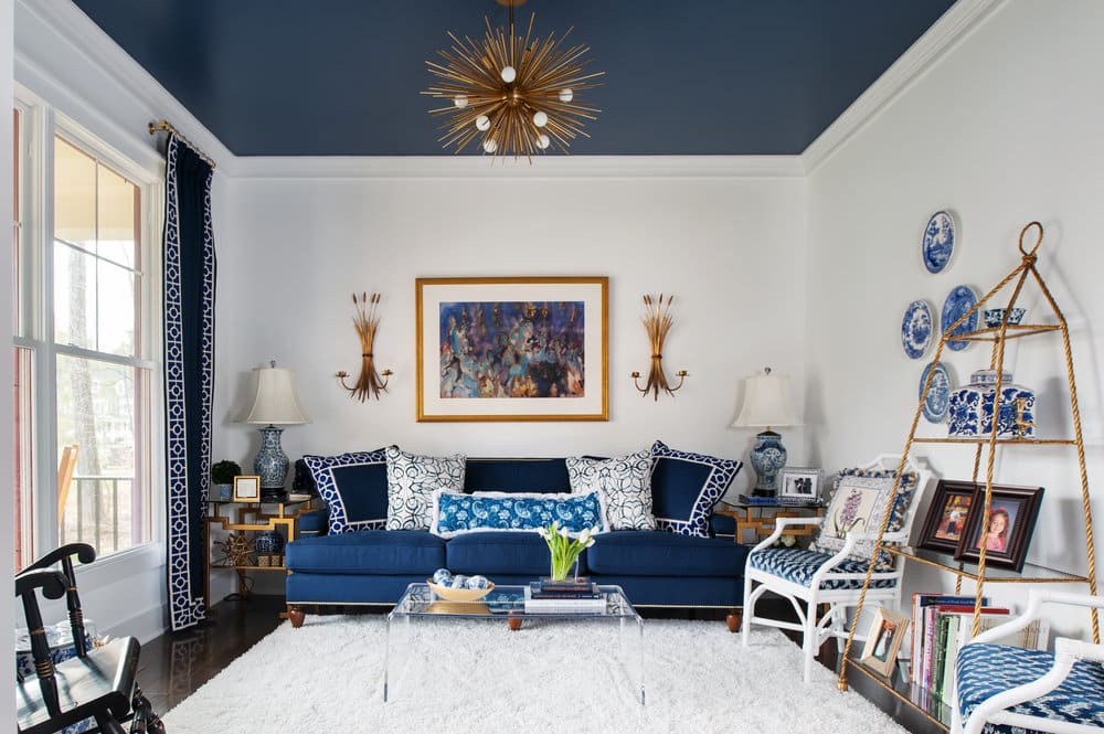 living room with navy ceiling and pops of navy throughout the room