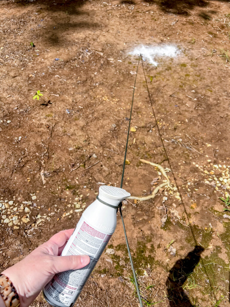 Spray paint tied to string for DIY fire pit