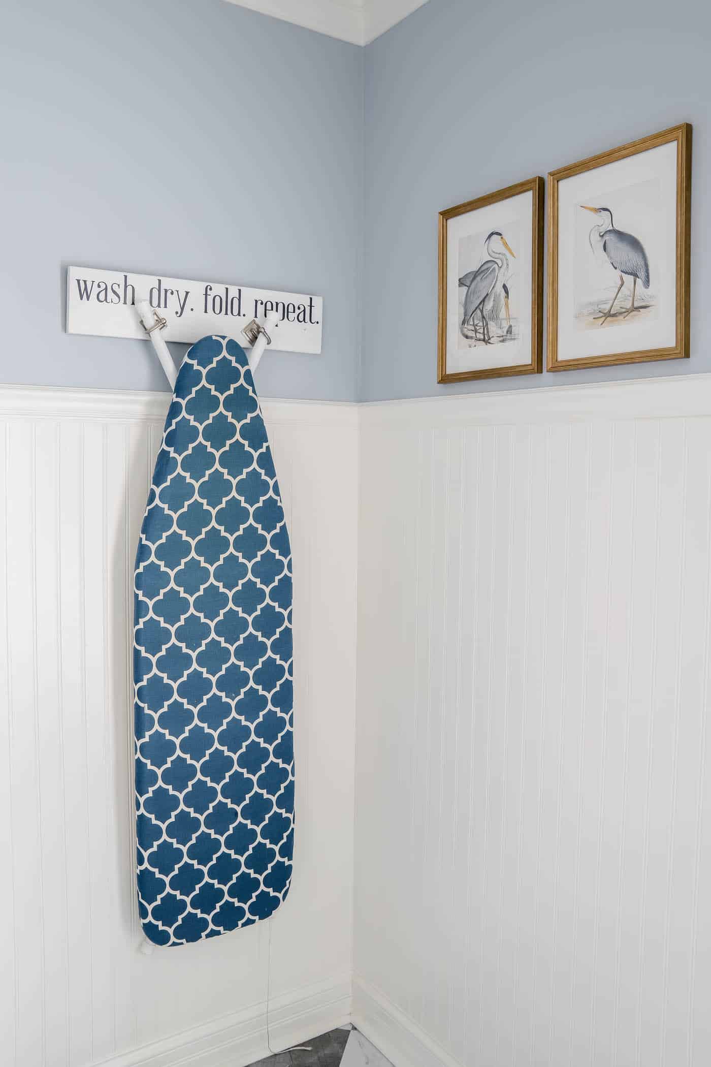 Blue and white laundry room with beadboard