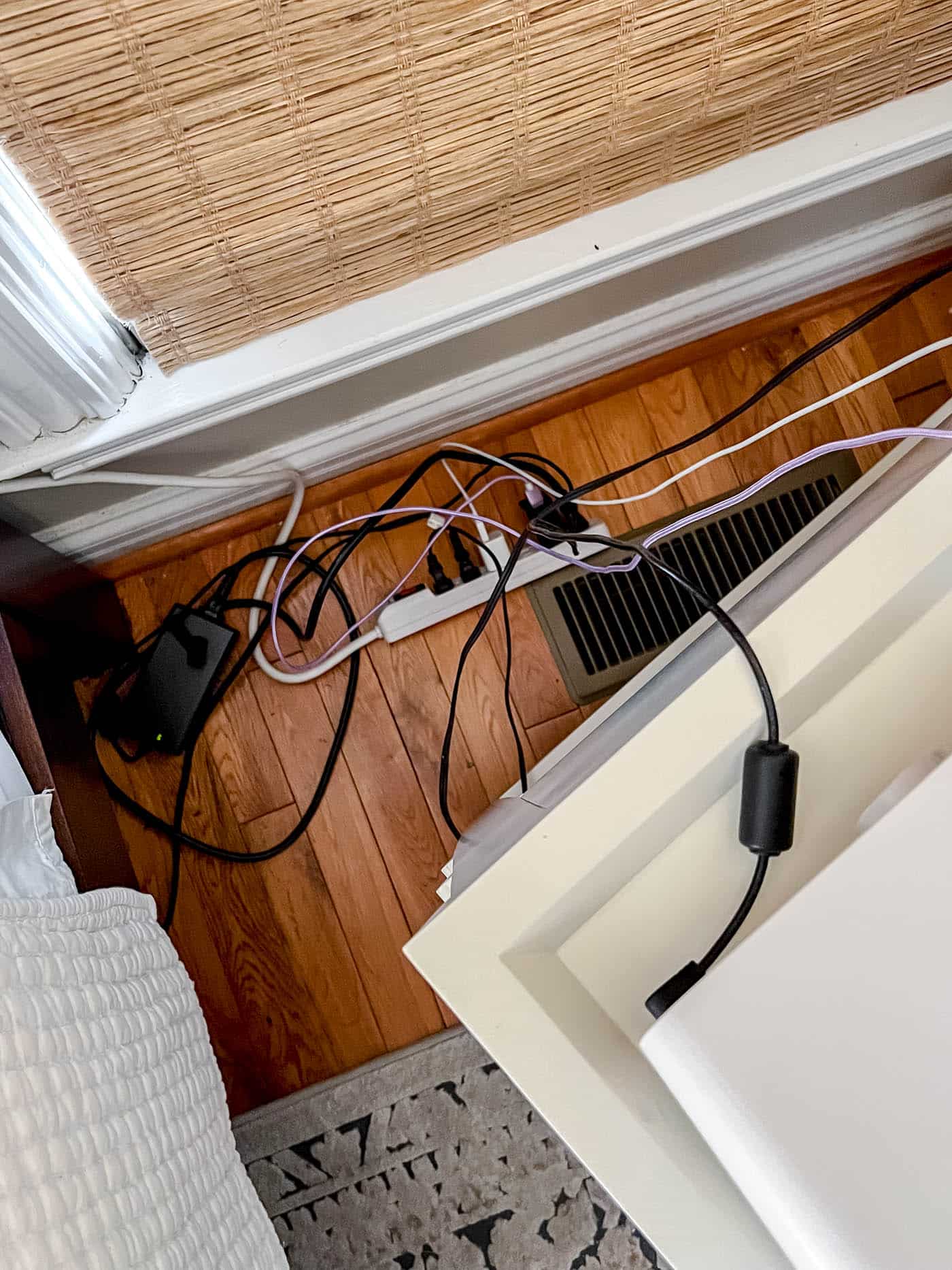 messy cords behind nightstand 