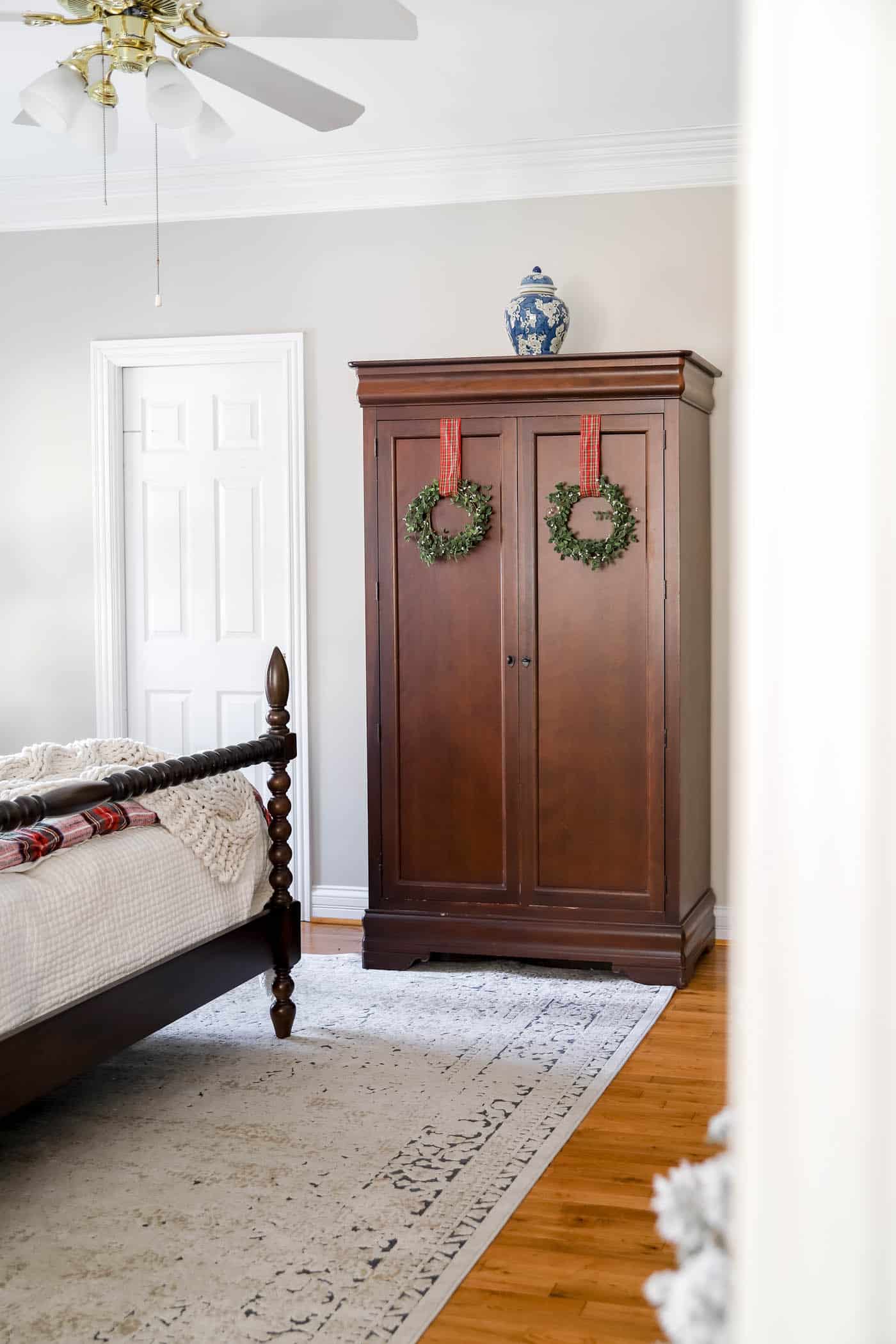 Wreaths on the armoire in Christmas bedroom