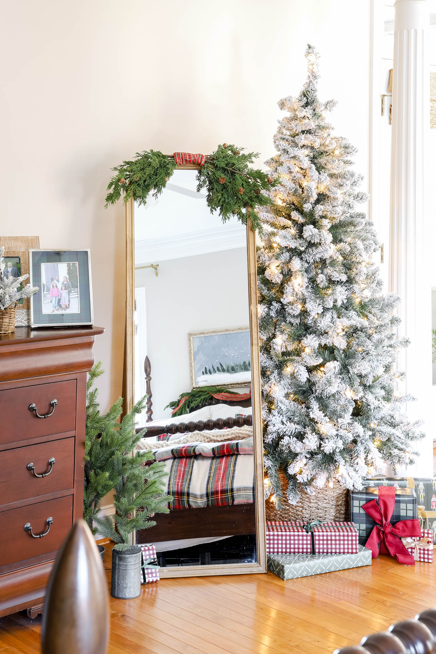 flocked, naked tree in primary bedroom Christmas decor
