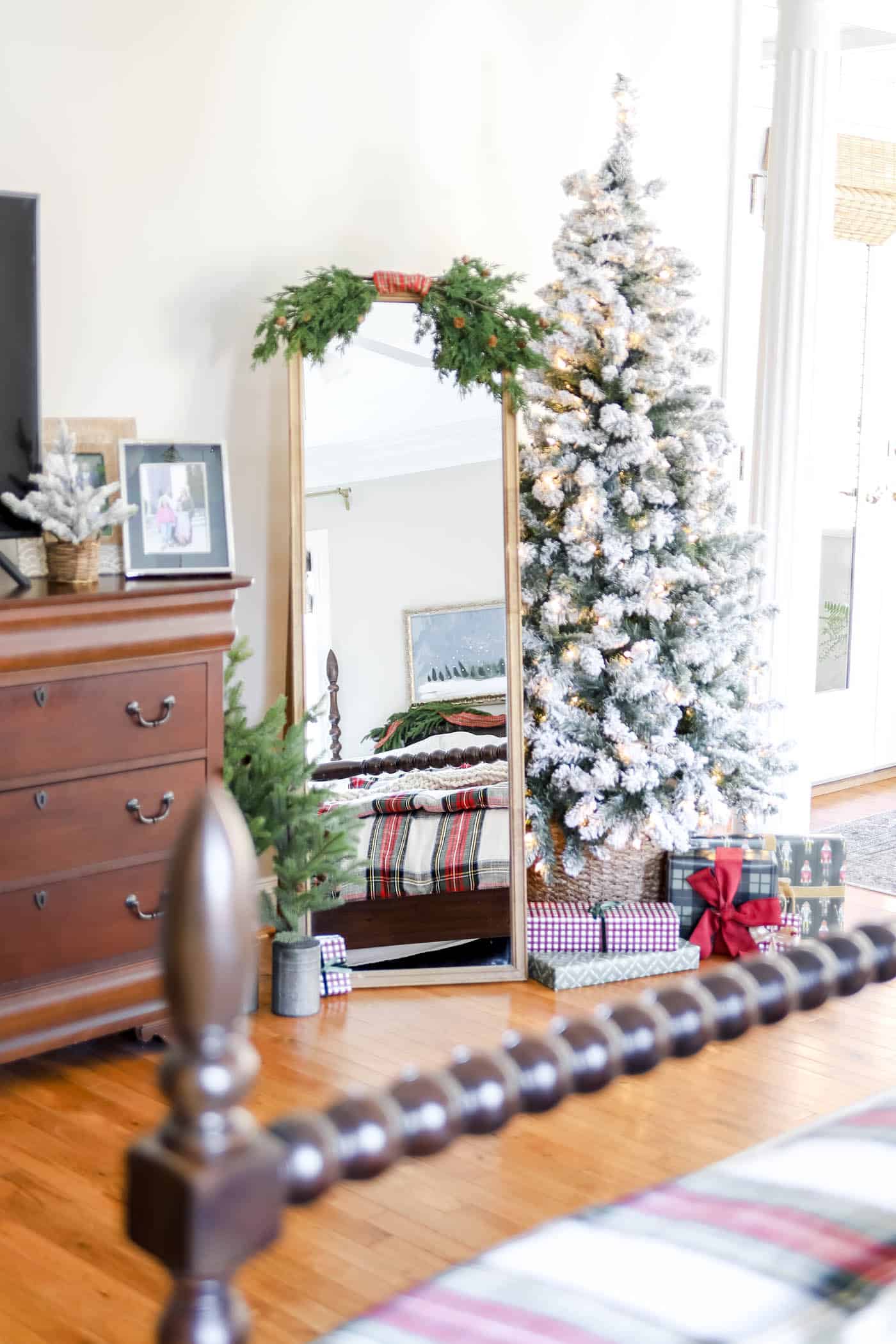flocked, naked tree in primary bedroom Christmas decor