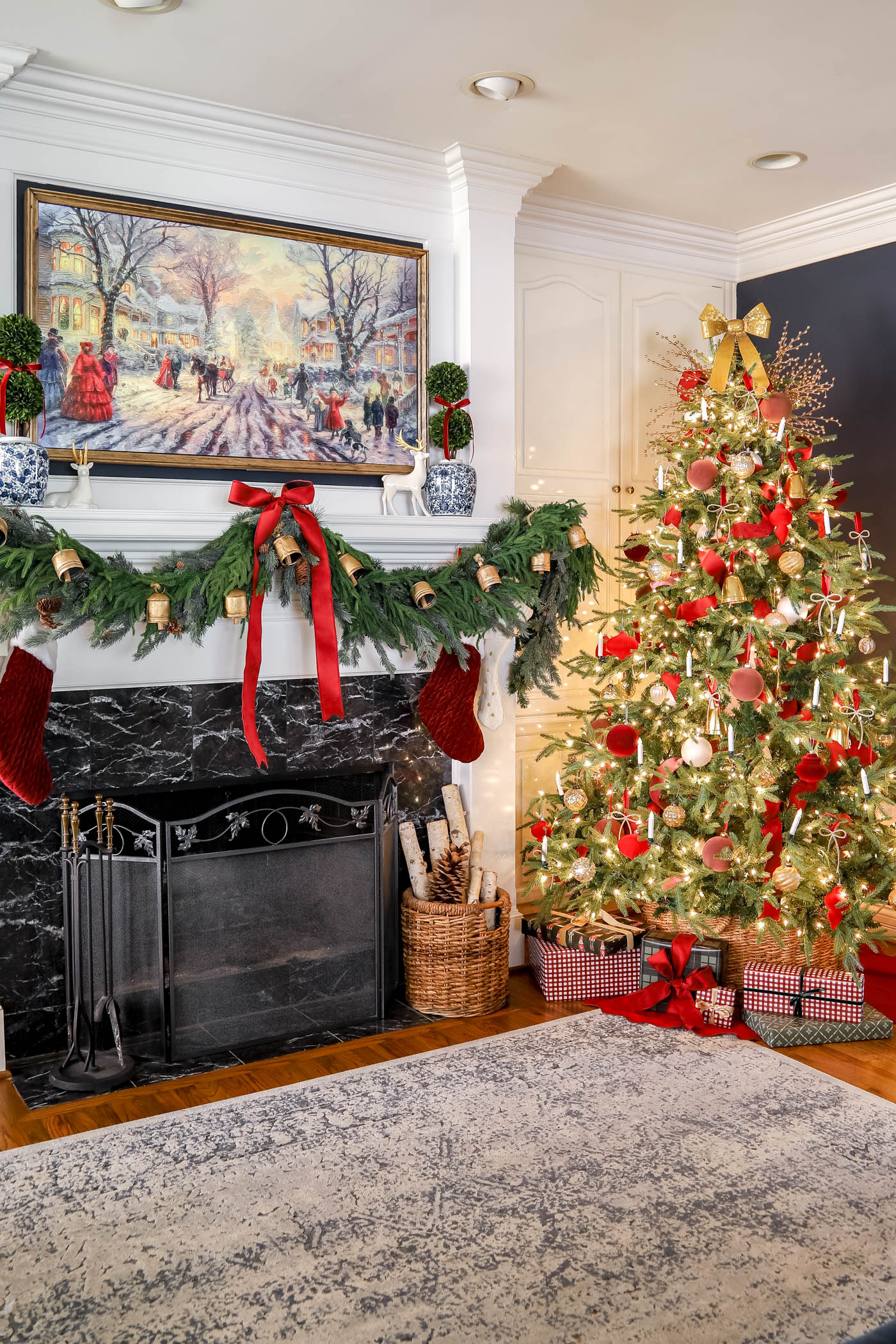wrapped gifts under tree in red christmas decor room