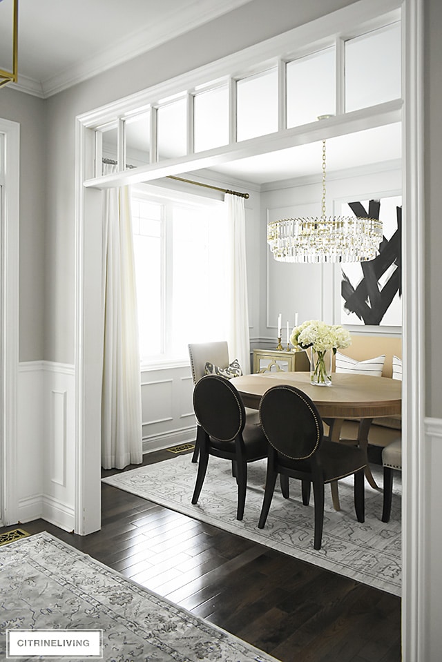 Dining room with Stonington Gray walls and crystal chandelier.