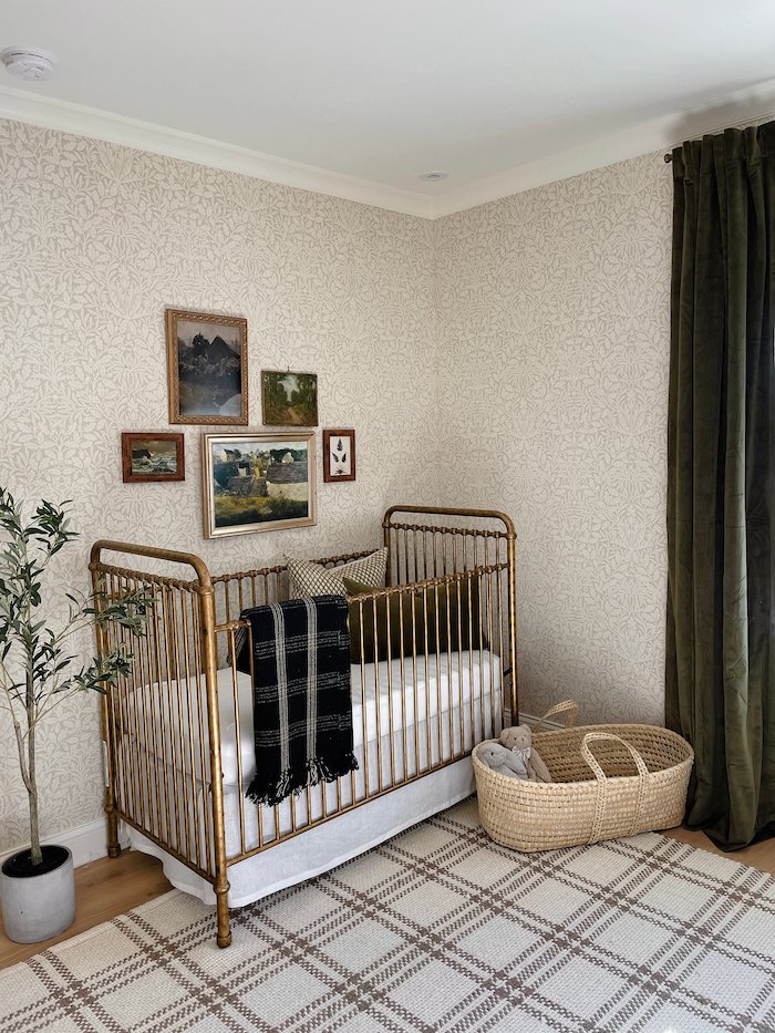 traditional woodland wallpaper in a gender-neutral nursery.